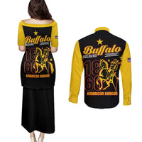 Back view: black pulletasi and yellow long-sleeve button shirt with Buffalo Soldiers print