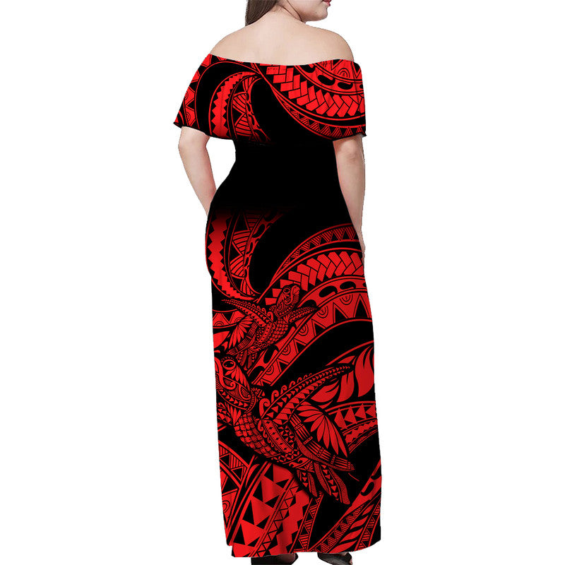 Off-shoulder long dress, back view; black base with red Polynesian-style motifs