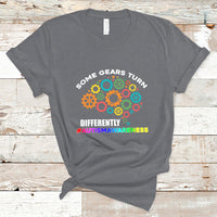 Charcoal autism awareness graphic T-shirt with colorful gears and slogan text