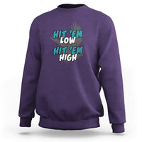 Purple groovy sweatshirt with "Hit 'Em Low" "Hit 'Em High" chest graphic