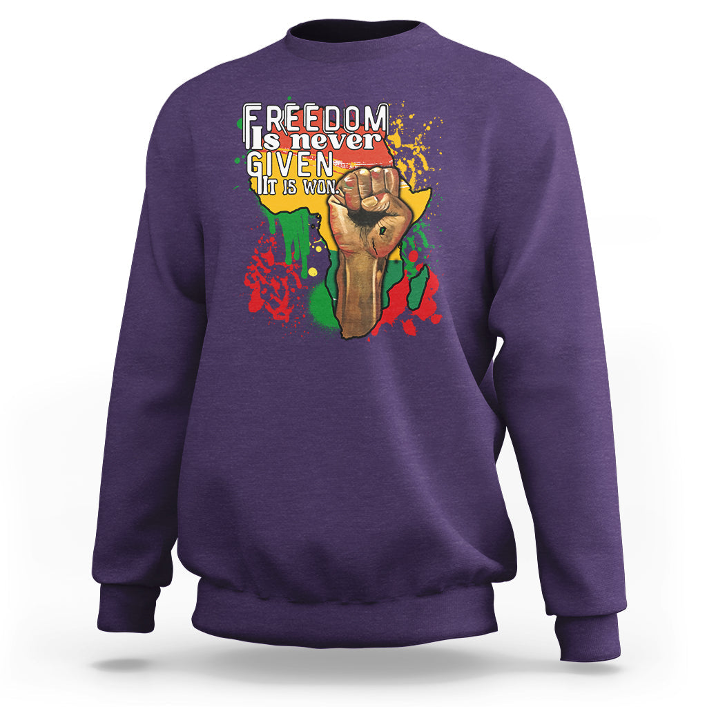 Purple crewneck sweatshirt with colorful freedom graphic on the chest