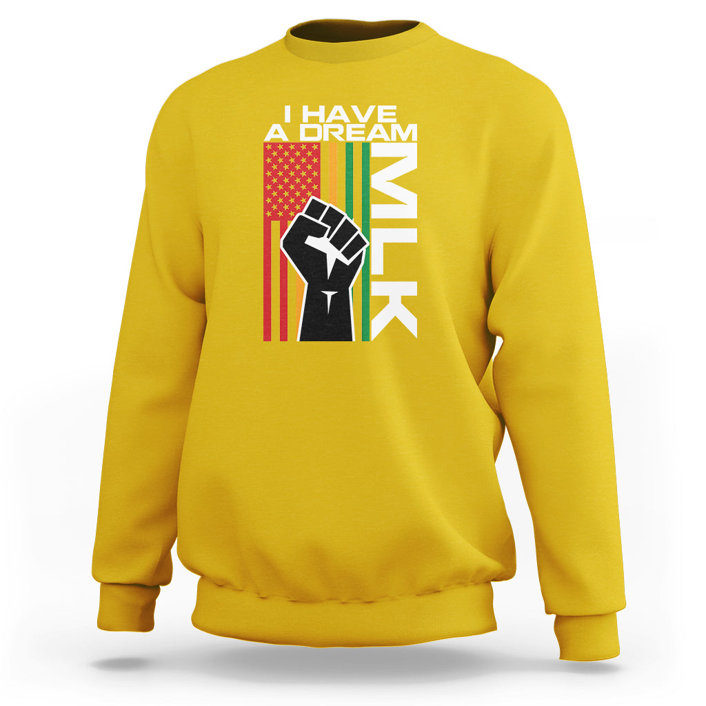 Daisy yellow crewneck sweatshirt with “I HAVE A DREAM” text and raised-fist graphic