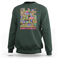 Forest green crewneck sweatshirt with colorful cat-and-bookshelf graphic and text