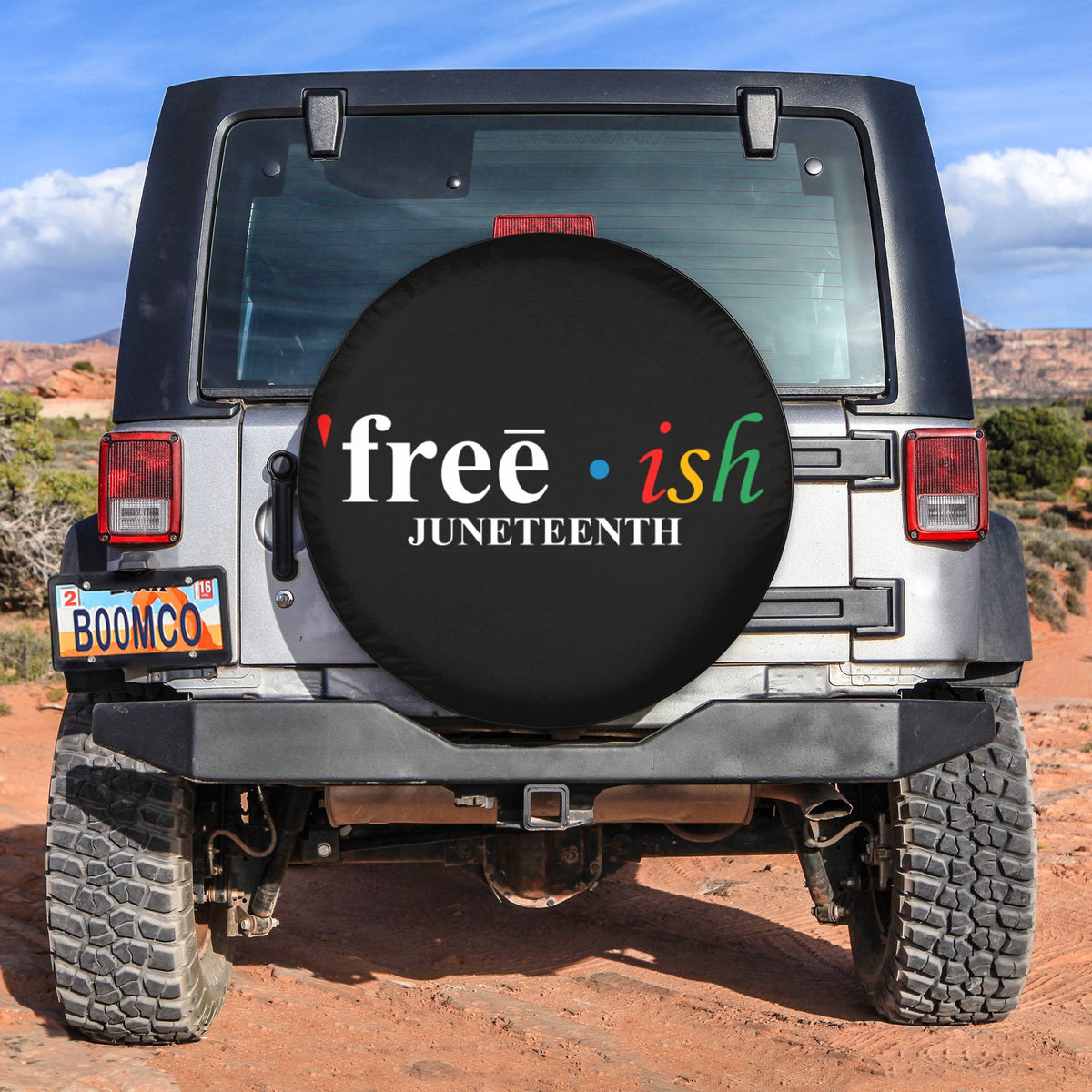 Black spare tire cover with centered “free · ish” and “Juneteenth” text