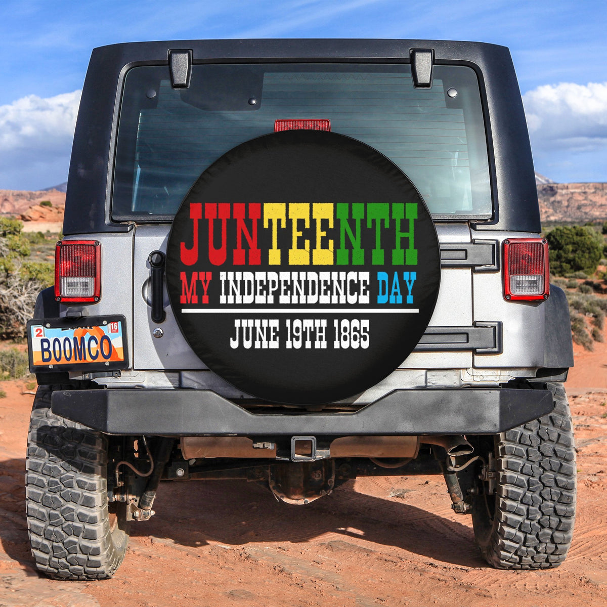 Black circular spare tire cover with Juneteenth text and Independence Day message
