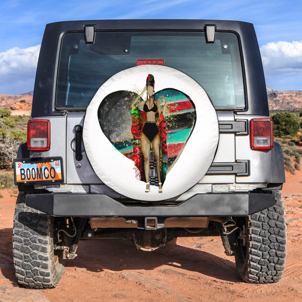 Black spare tire cover with white border and colorful portrait graphic centered