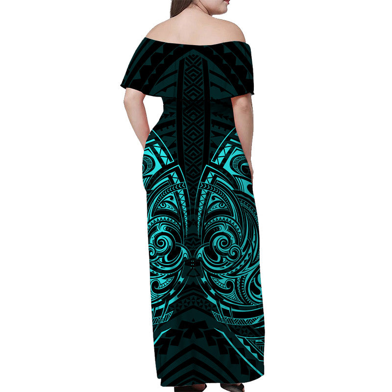 Off-shoulder long dress with tribal print, dark green and turquoise, back view.