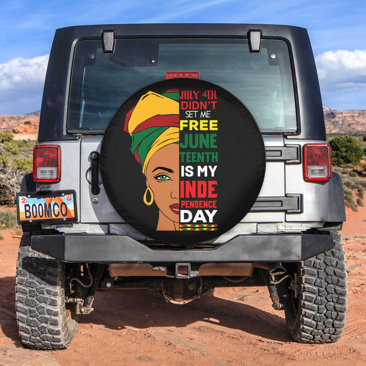 Round black spare tire cover with colorful Juneteenth text and portrait illustration