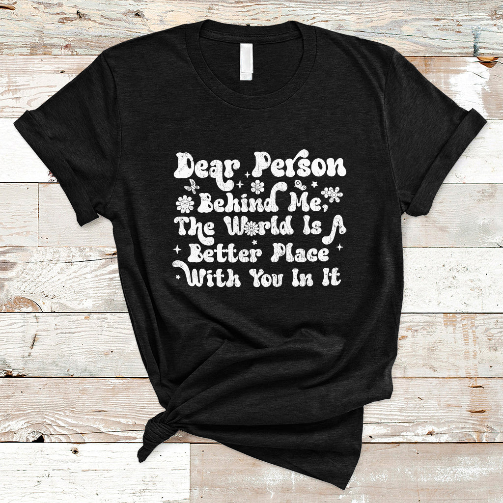 Black crew-neck T-shirt with white inspirational text and flower icon graphic.