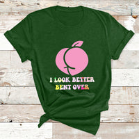 Forest green graphic T-shirt with pink apple and slogan 'I LOOK BETTER BENT OVER'