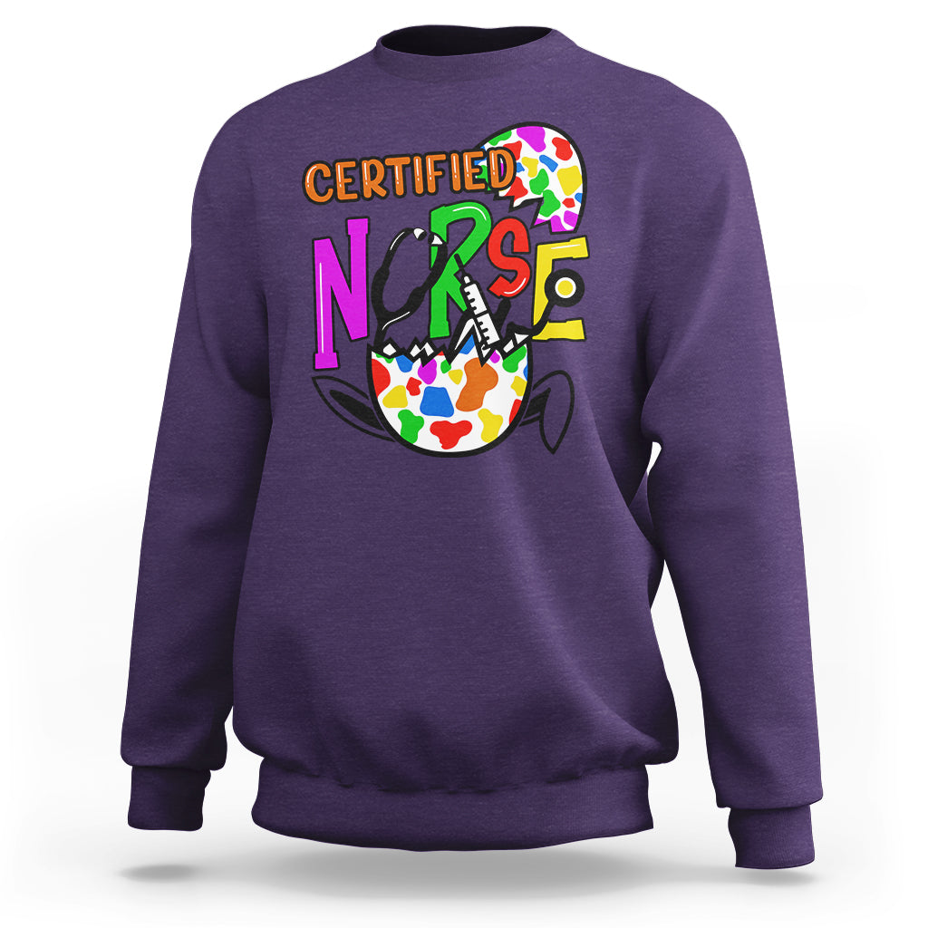 Purple nurse Easter sweatshirt with colorful “CERTIFIED NURSE” egg graphic