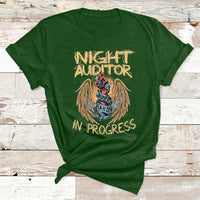 Night Auditor graphic T-shirt in forest green, angel badge reading 'Night Auditor' 'In Progress'