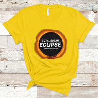 Daisy yellow total solar eclipse T-shirt with circular “TOTAL SOLAR ECLIPSE” and “APRIL 8th 2024”
