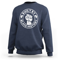 Navy crewneck sweatshirt with round “Built by Black History” graphic badge on chest