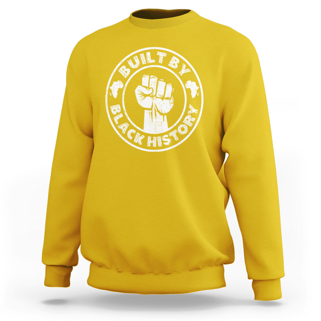 Daisy yellow crewneck sweatshirt with round “Built by Black History” graphic badge on chest