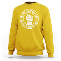 Daisy yellow crewneck sweatshirt with round “Built by Black History” graphic badge on chest