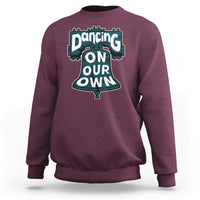 Maroon crewneck sweatshirt for adults with large front slogan graphic
