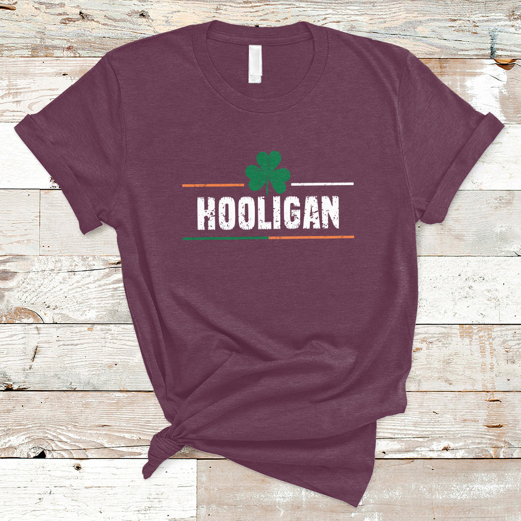 St. Patrick's Day graphic t-shirt in maroon with green clover and HOOLIGAN text.