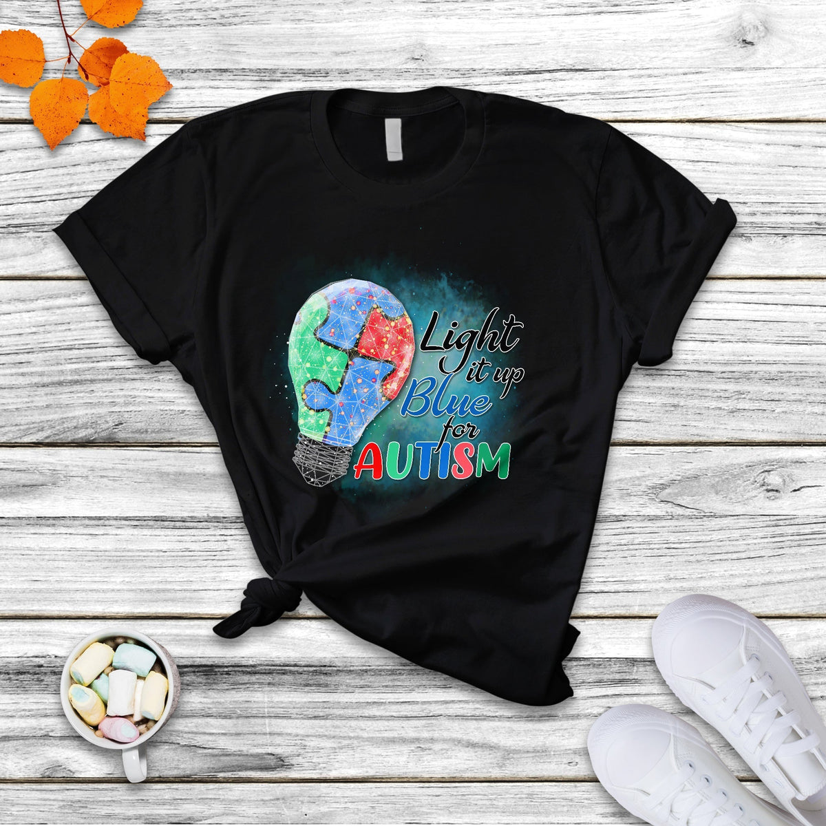 Black autism awareness T-shirt, puzzle graphic with “Light it up for Autism” text