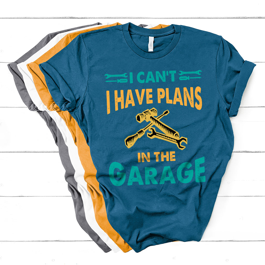 Teal-blue crew-neck mechanic graphic T-shirt with tools and "GARAGE" lettering