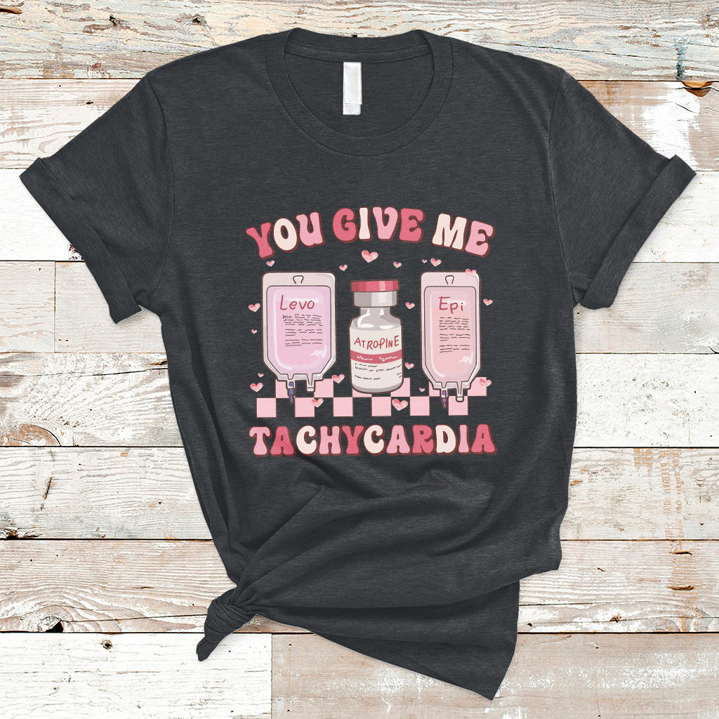 Black nurse-themed graphic t-shirt with “You give me tachycardia” medical bottle design