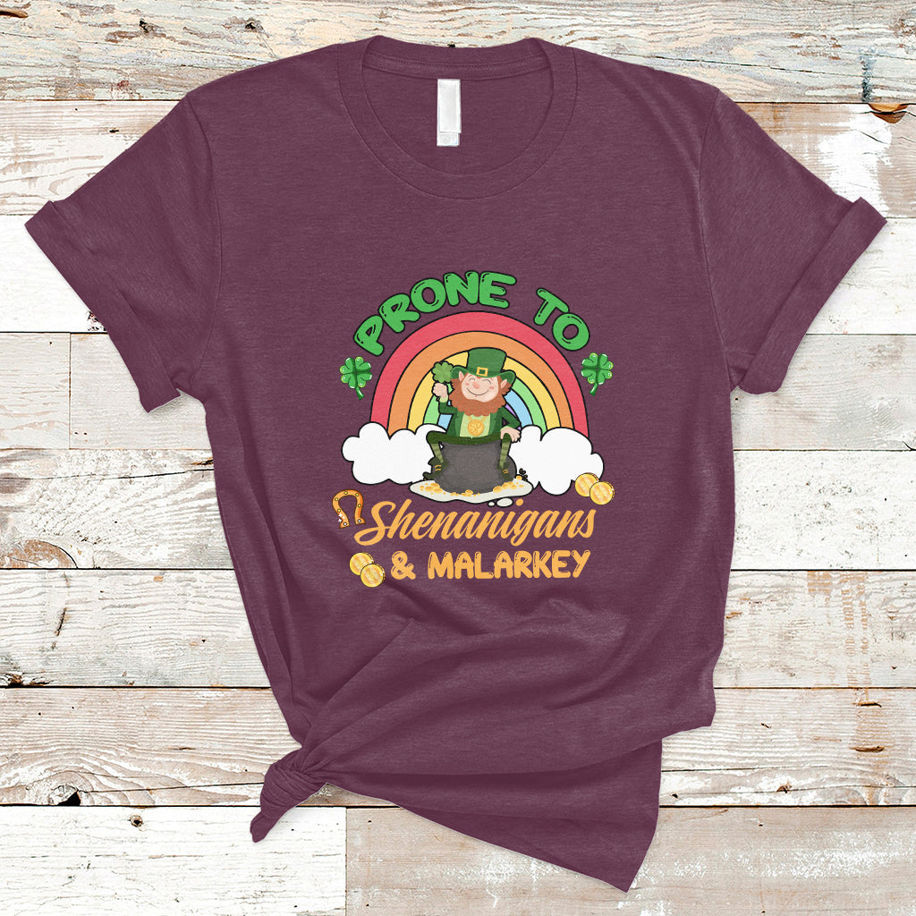 Maroon crewneck T-shirt with rainbow leprechaun graphic and clover text, short sleeves.