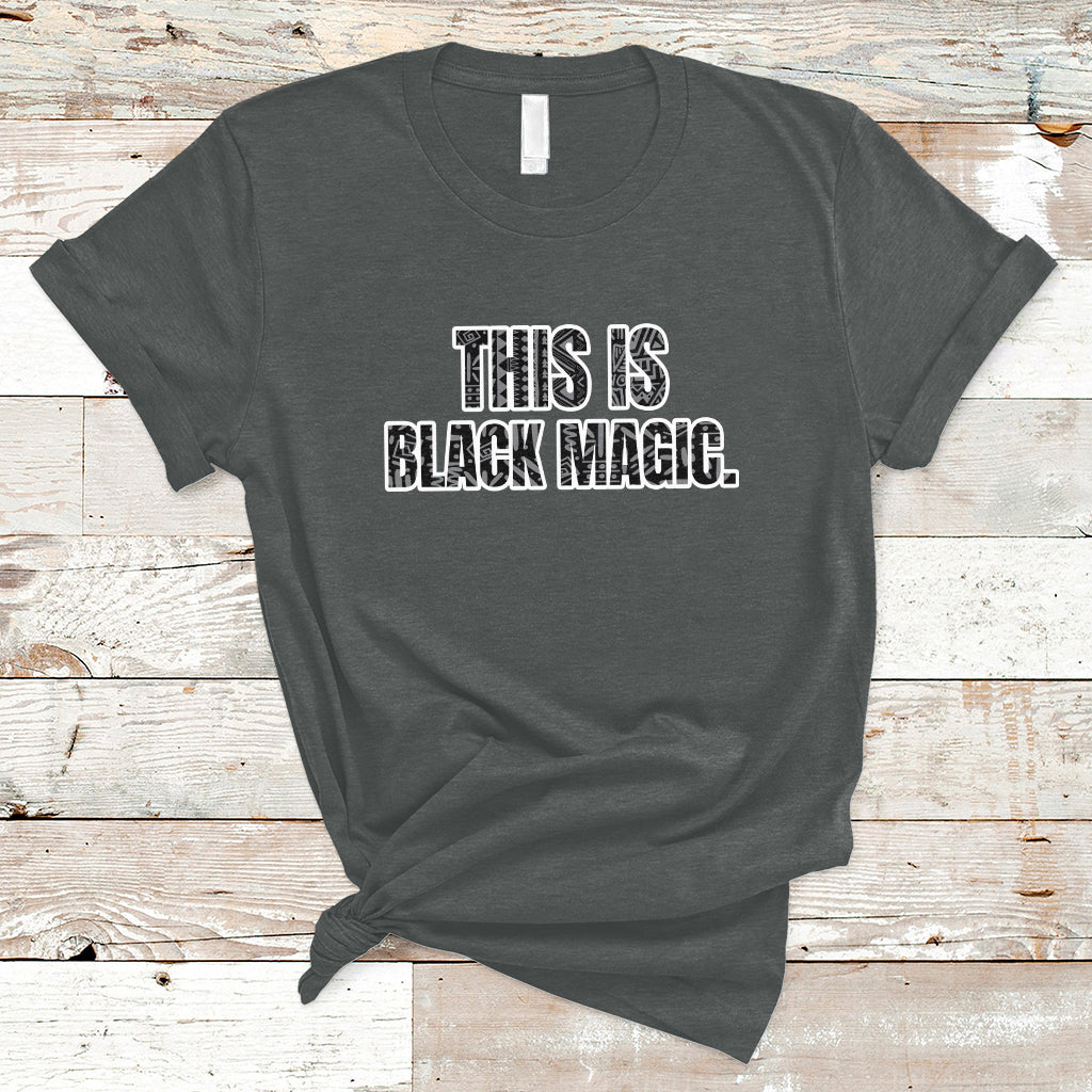 Dark gray crewneck T-shirt with 'THIS IS BLACK MAGIC' graphic on the front
