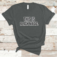 Dark gray crewneck T-shirt with 'THIS IS BLACK MAGIC' graphic on the front