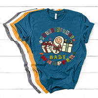 Nurse baby wrapper T-shirt in teal blue with colorful nurse-themed baby graphic