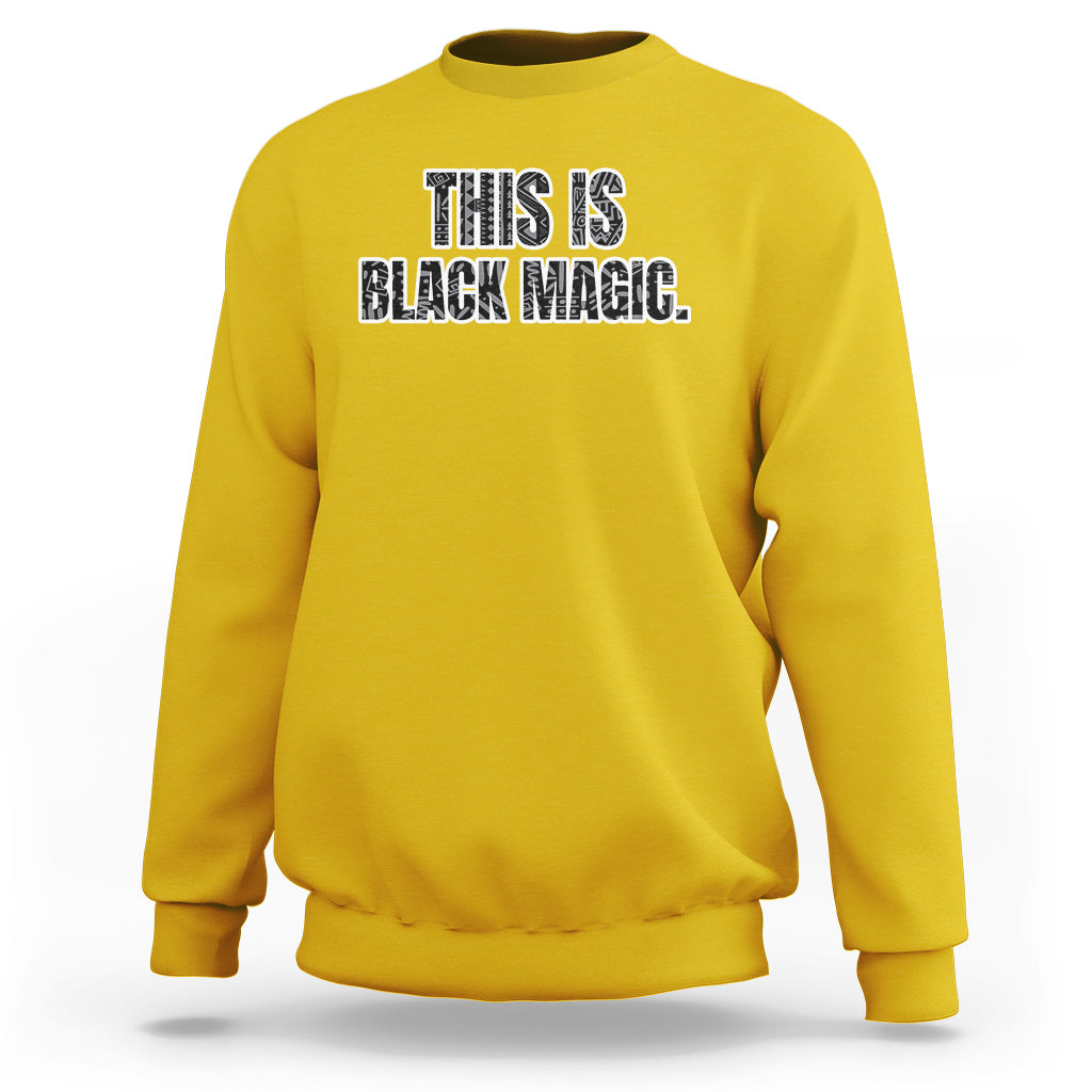Daisy yellow crewneck sweatshirt with “THIS IS BLACK MAGIC” front graphic.