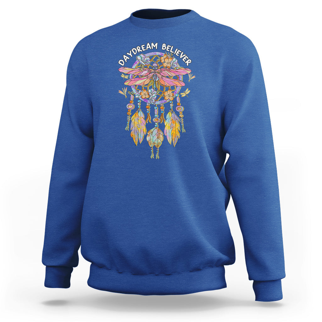 Royal blue crewneck sweatshirt with colorful dreamcatcher graphic and “Daydream Believer” text