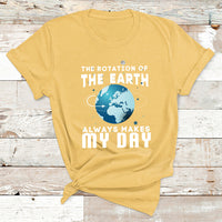 Yellow earth-rotation graphic T-shirt with globe icon and “ALWAYS MAKES MY DAY”