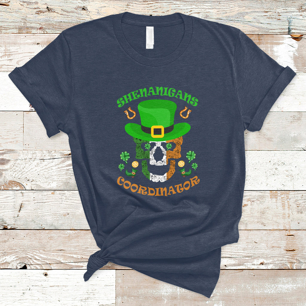 Navy T-shirt with green leprechaun hat skull graphic and text "Shenanigans Coordinator"