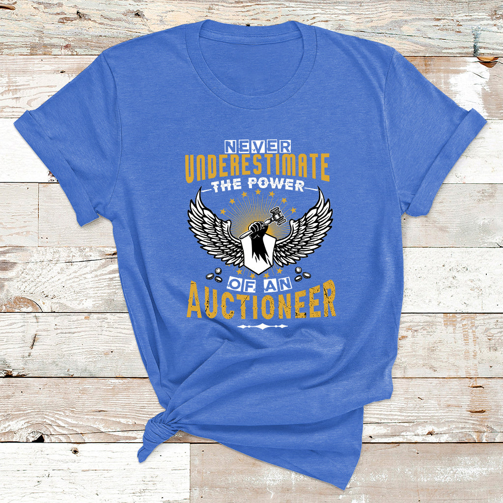 Royal blue t-shirt with "Never Underestimate the Power" auctioneer wing graphic