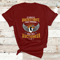 Maroon t-shirt with "Never Underestimate the Power" auctioneer wing graphic