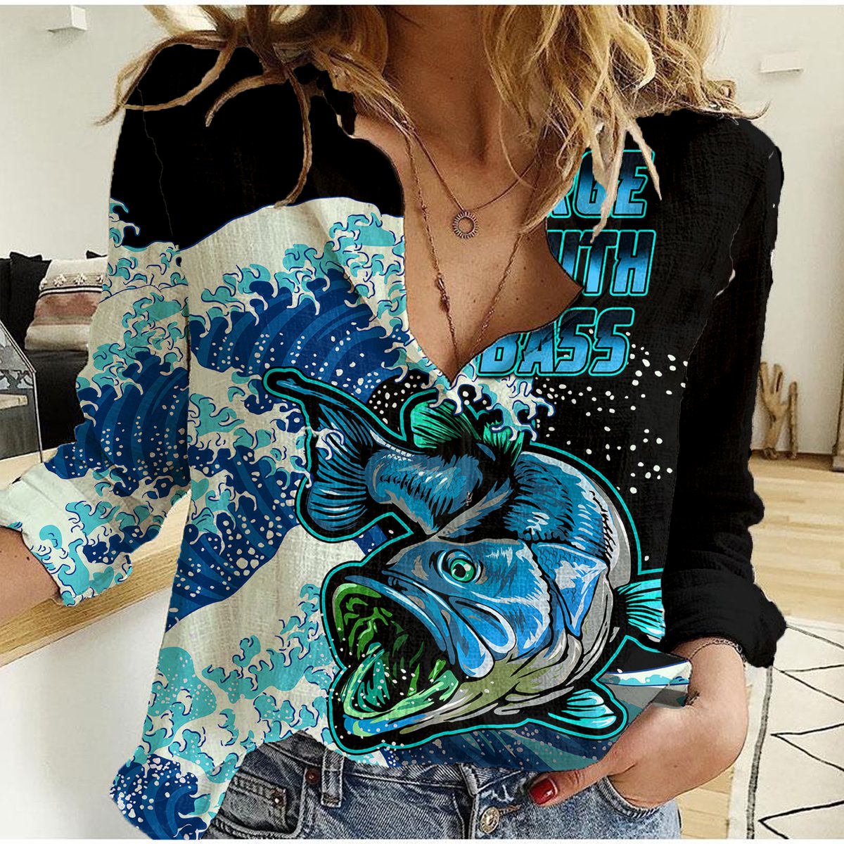 Women's black casual shirt with blue teal fish and waves graphic