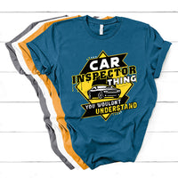 Blue short-sleeve T-shirt with yellow car inspector graphic and text
