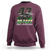 Maroon racing sweatshirt with front GO FAST graphic and long sleeves