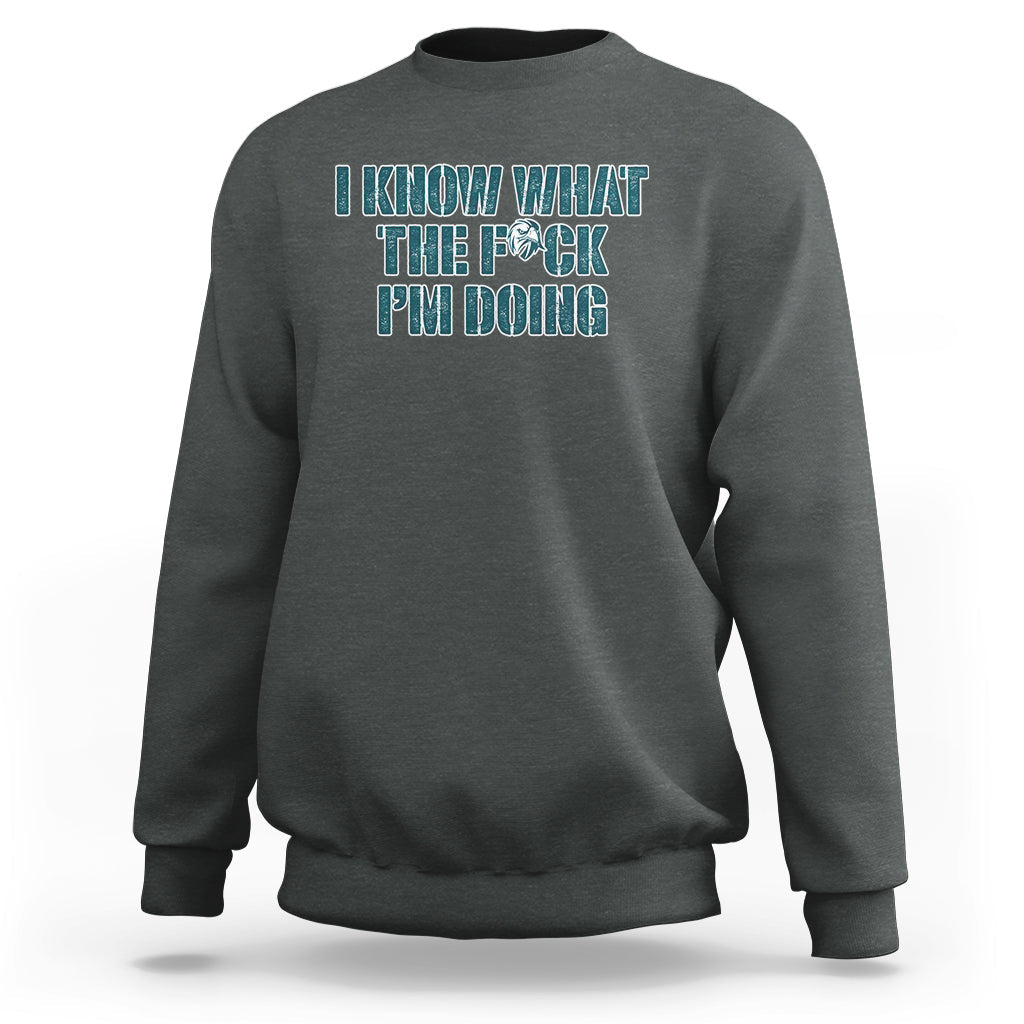 Dark gray crewneck sweatshirt with front printed sarcastic text graphic, long sleeves