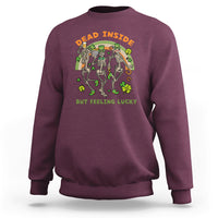 Maroon crewneck sweatshirt with green-and-orange skeleton St. Patrick graphic on front