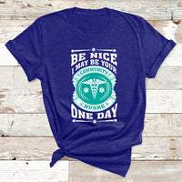 Community nurse slogan T-shirt in navy with circular emblem and 'ONE DAY' print