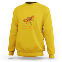 Mustard yellow dragonfly graphic sweatshirt with “Believe in yourself” front text and long sleeves.