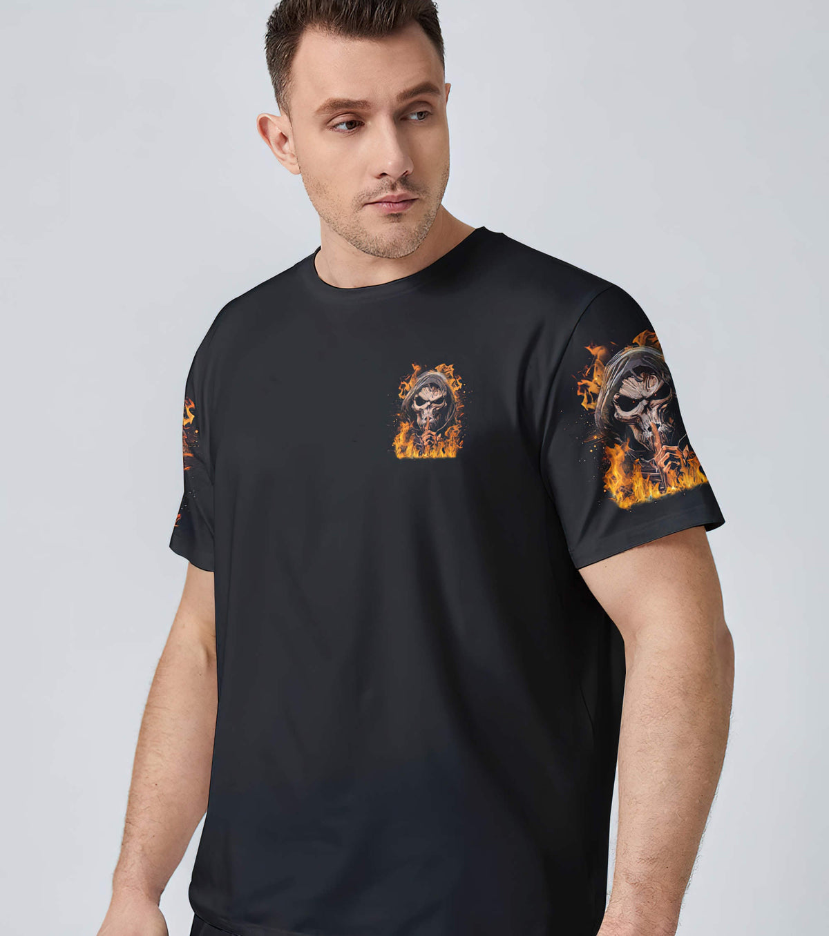 Black t-shirt with small flaming skull graphic on the chest