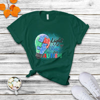Forest green autism awareness T-shirt with colorful puzzle graphic and “Light it up for Autism”