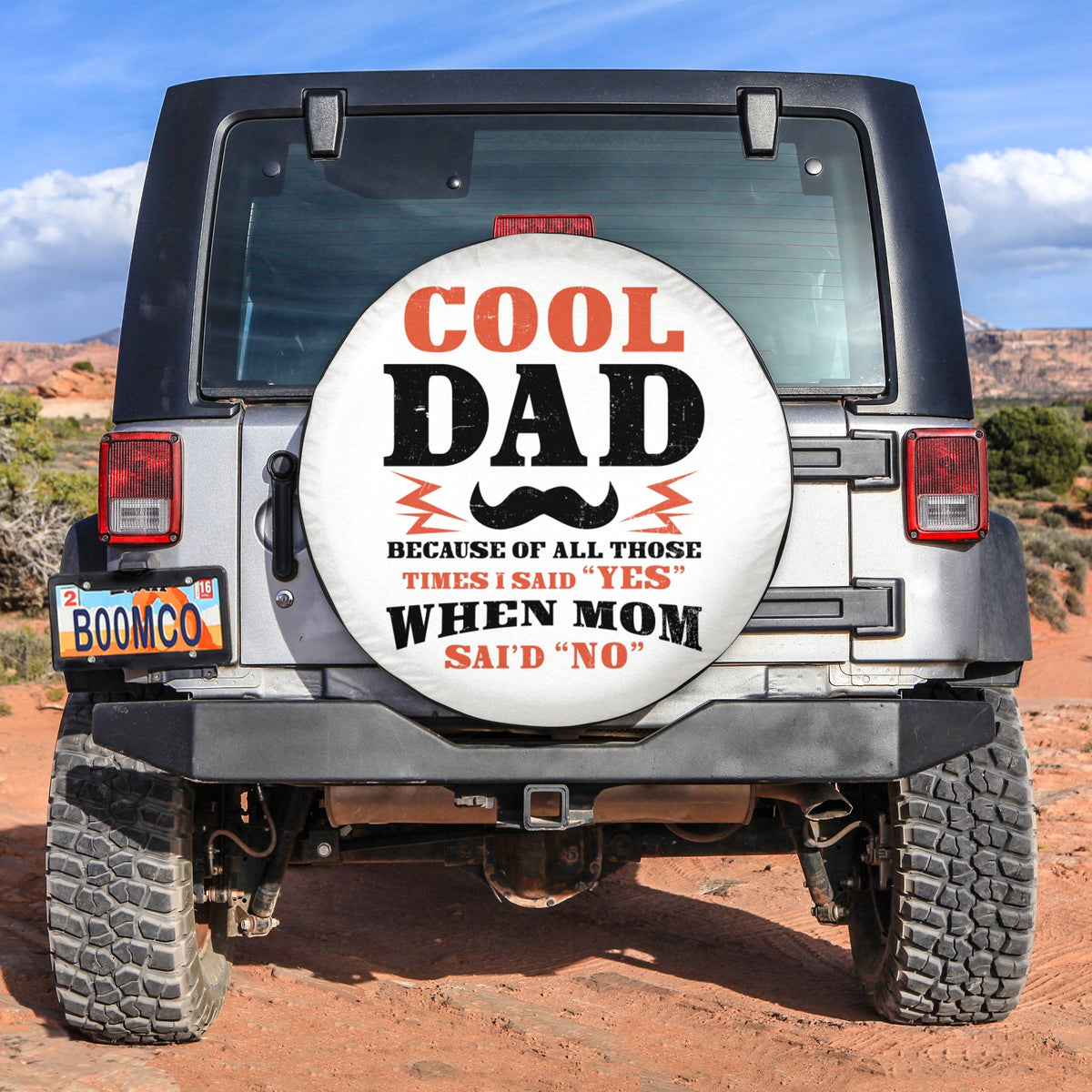 Black spare tire cover with round "COOL DAD" graphic for vehicles