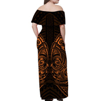 Women’s off-shoulder long dress, back view with black and gold tribal print