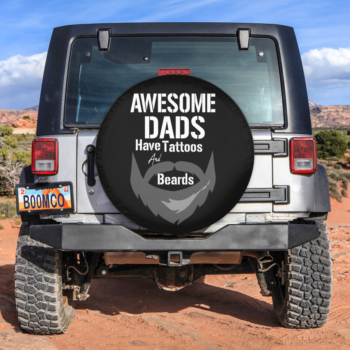 Black spare tire cover with circular graphic reading "Awesome Dads" and bearded face