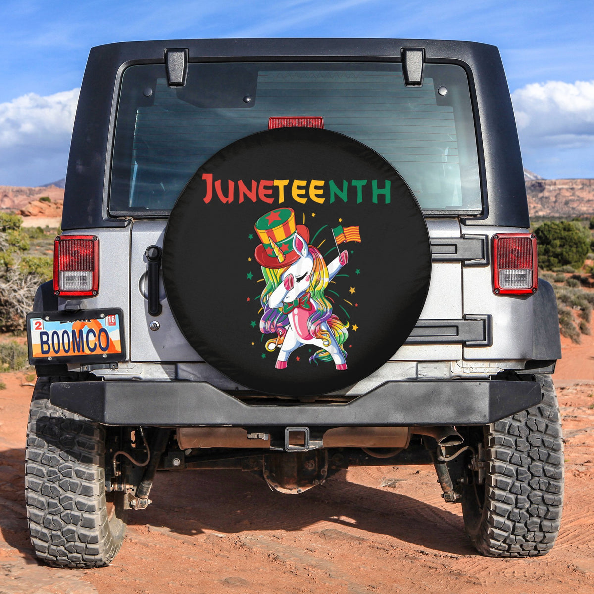 Spare tire cover, round black fabric with Juneteenth text and dabbing unicorn graphic