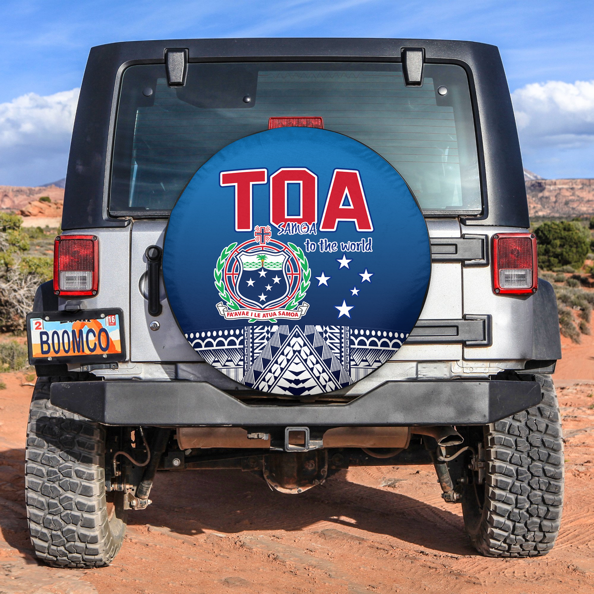Rugby spare tire cover, round blue design with red Toa Samoa logo and 'to the world' text