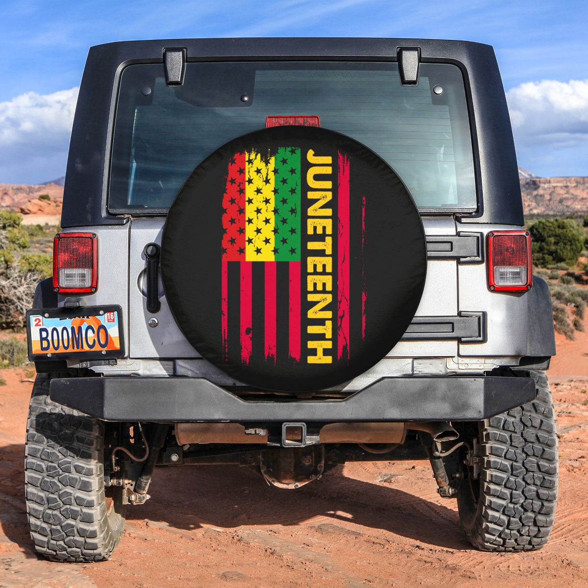 Spare tire cover with black background, Juneteenth design and raised flag stripes graphic